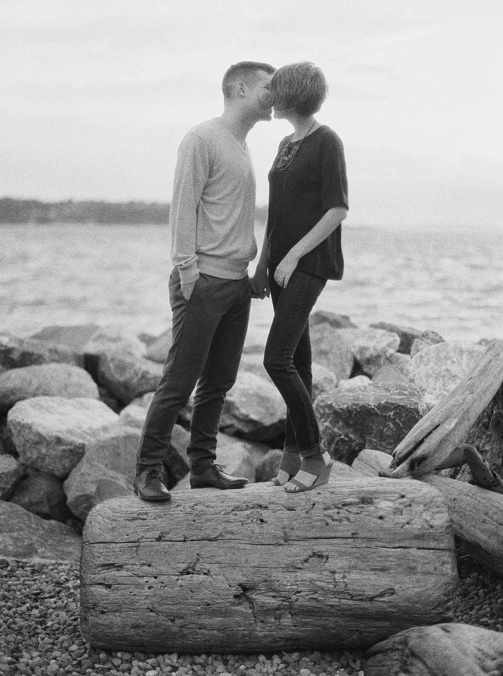 Romantic kiss on the Seattle Waterfront captured on Film by Seattle Engagement photographer Anna Peters