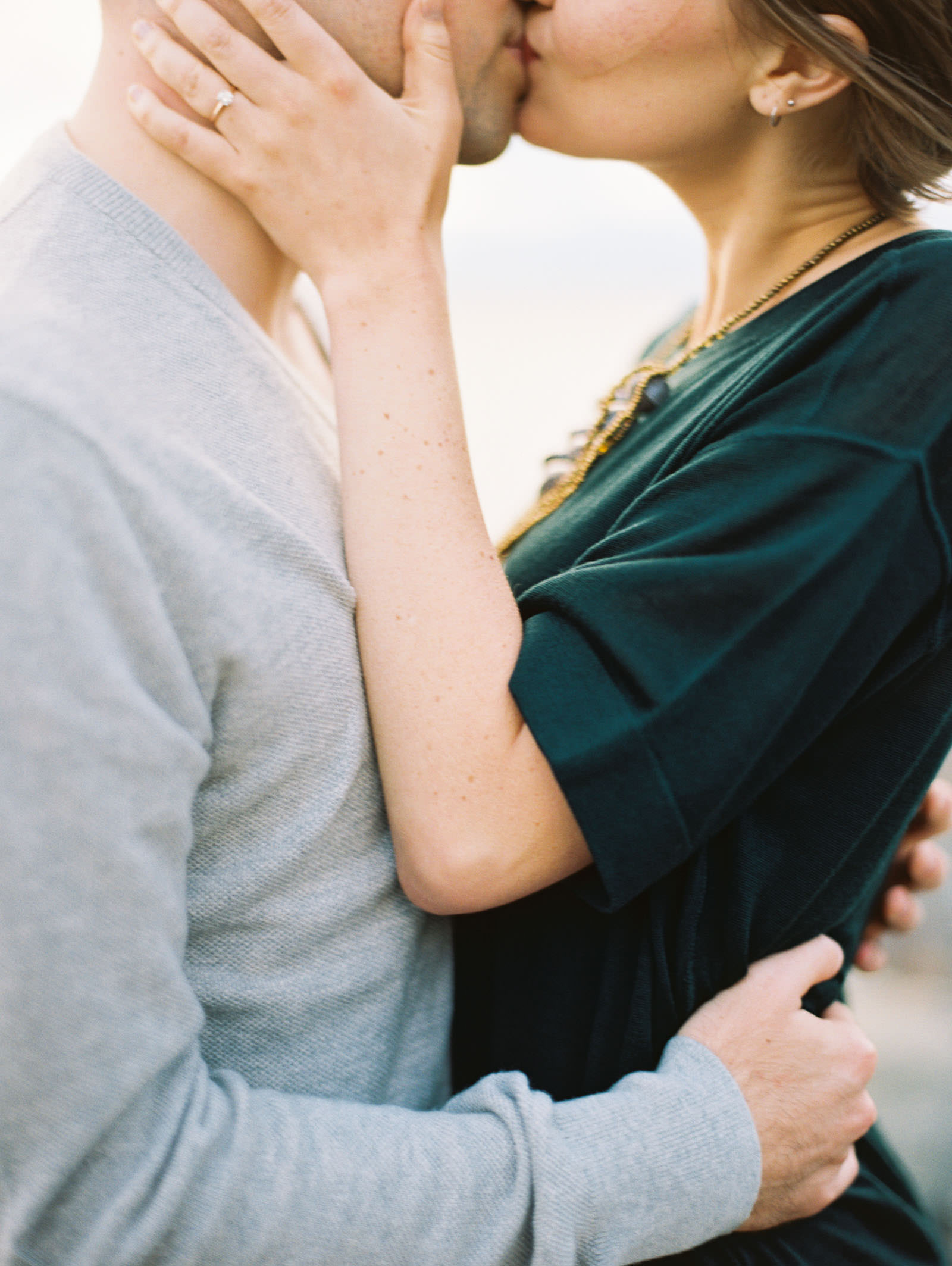 Romantic Kiss by the water captured by Seattle Engagement Photographer Anna Peters