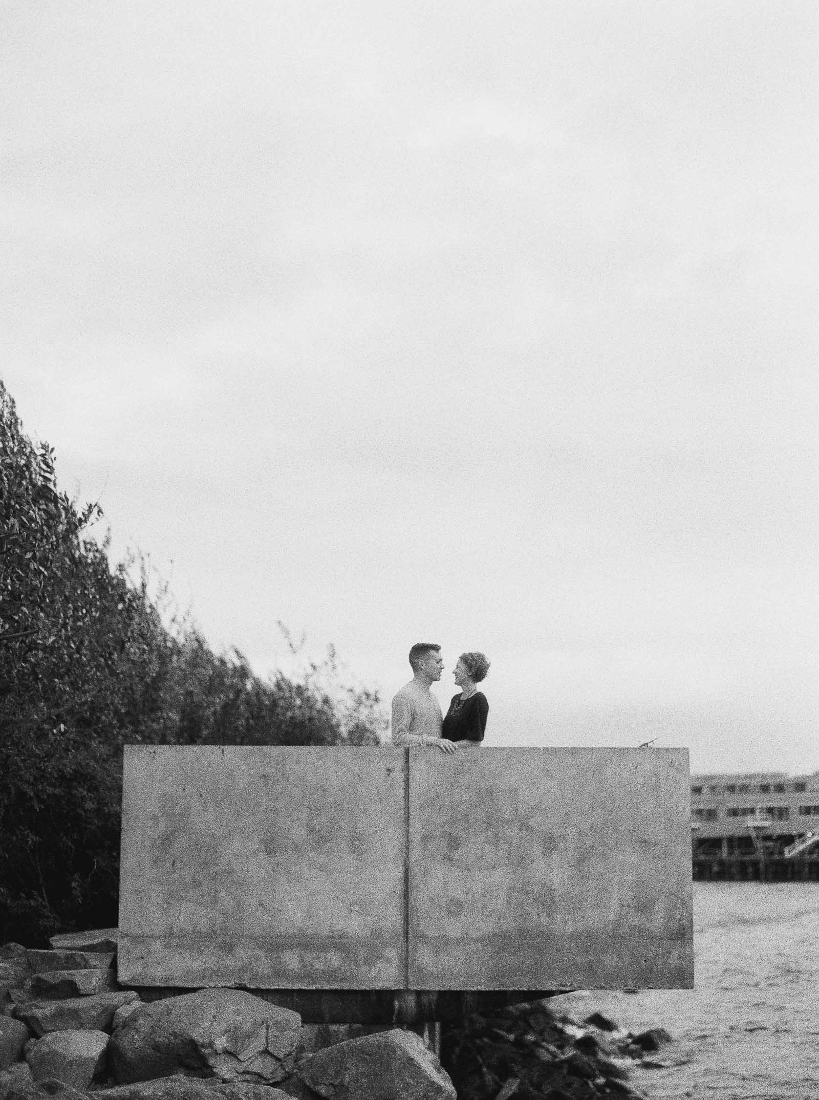 Classic black and white film photography on the Seattle waterfront by Seattle Engagement photographer Anna Peters